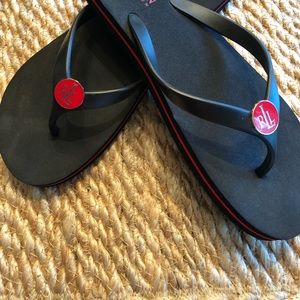 Black with red detail, Ralph Lauren flip-flops.